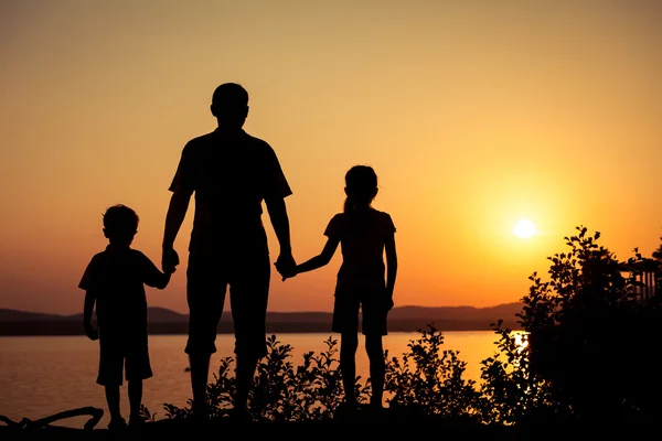 depositphotos_98683752-stock-photo-father-and-children-playing-on